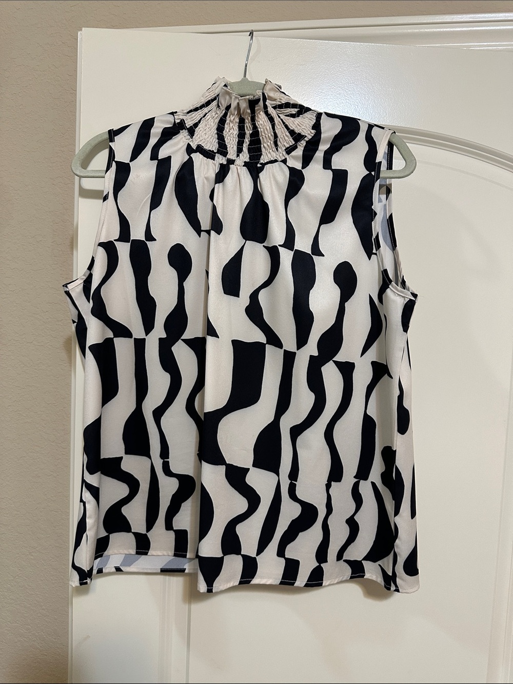 Sleeveless Black & White Smocked-Neck Printed Blouse